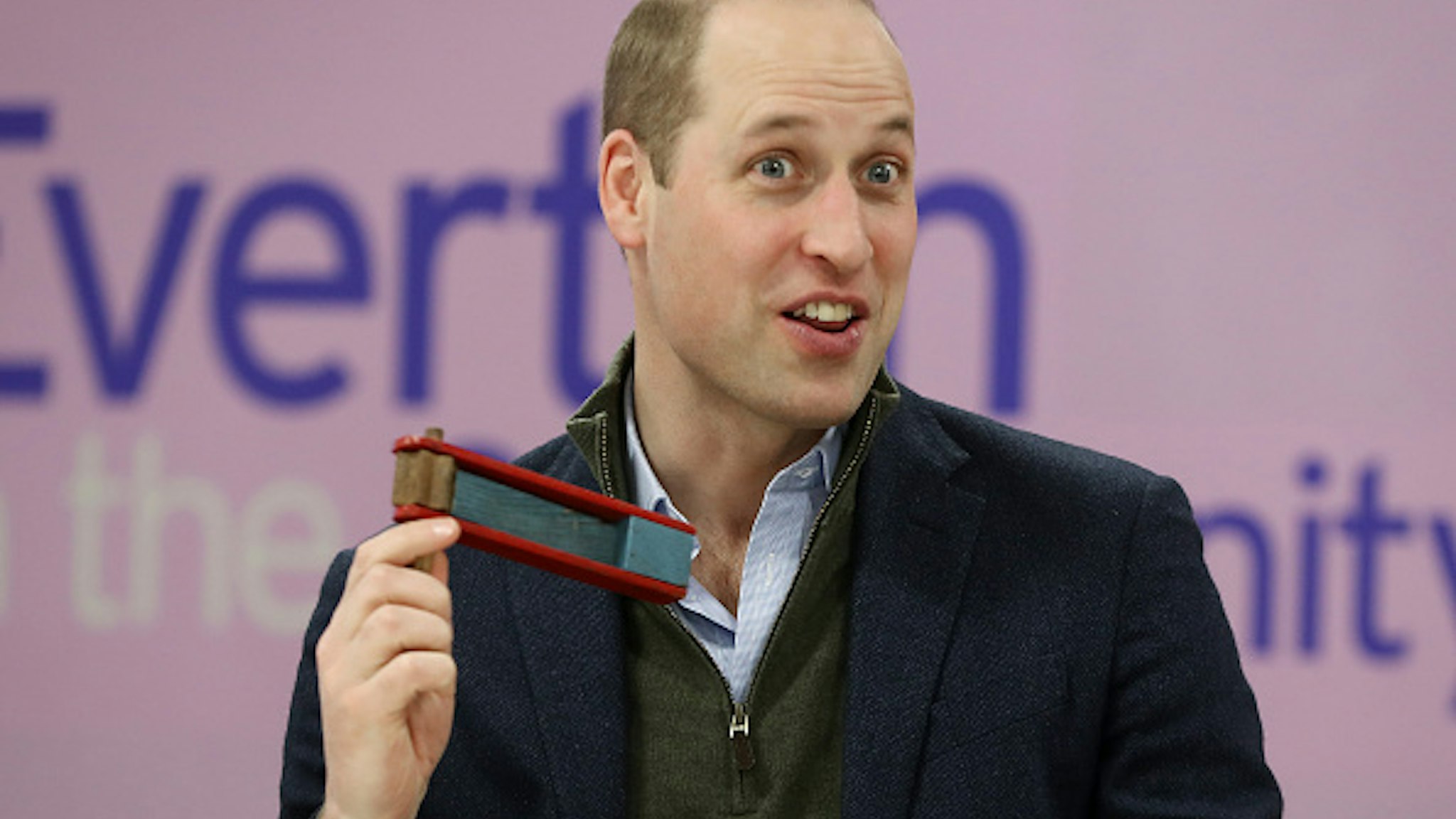 Britain's Prince William, Duke of Cambridge uses a memorabilia rattle during a visit to Everton Football Club's official charity Everton in the Community, in Liverpool on January 30, 2020, as part of the Heads Up mental health campaign.