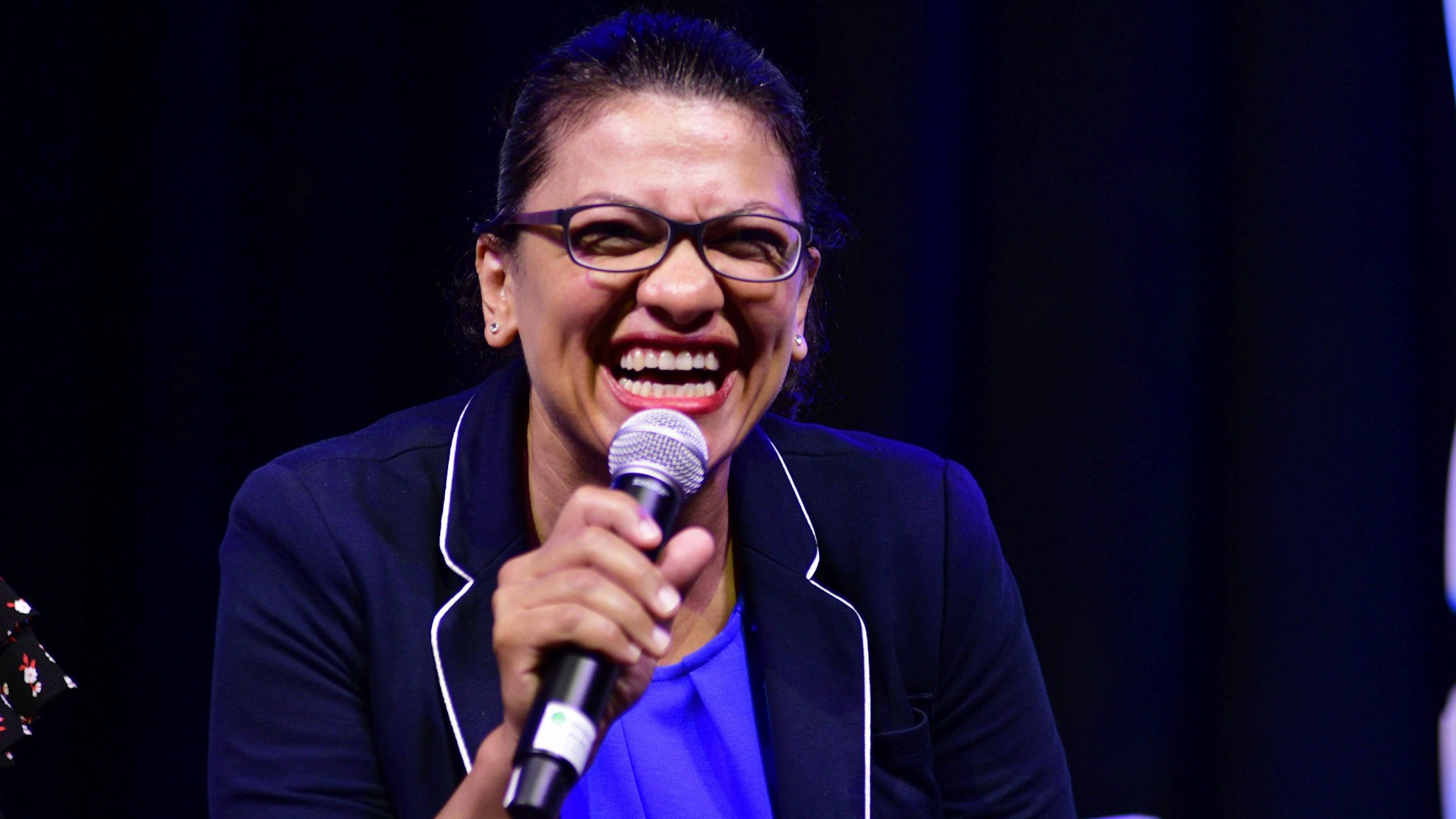 Rep. Rashida Tlaib (D-MI) speaks on the current political climate and possible impeachment of the current President during a panel discussion led by Aimee Allison, touching the changes of the face of power in the United States after a history making number of diverse members were sworn into Congress the past elections, during a keynote discussion of the Netroots Nation progressive grassroots convention in Philadelphia, PA, on July 13, 2019.