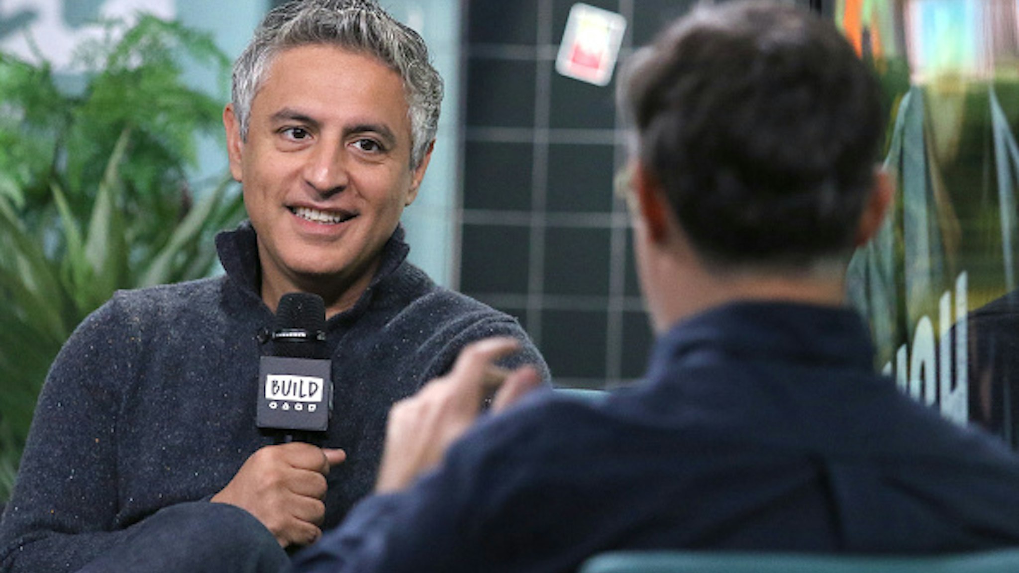 NEW YORK, NEW YORK - NOVEMBER 14: Writer Reza Aslan (L) and moderator Ricky Camilleri attends the Build Series to discuss his TV program "Rough Draft" at Build Studio on November 14, 2019 in New York City.