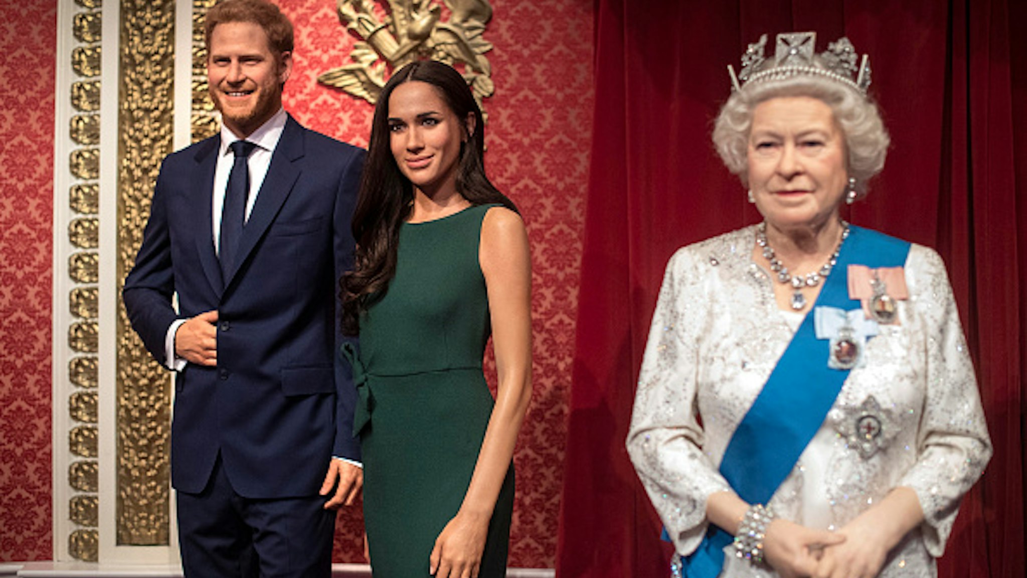 The figures of the Duke and Duchess of Sussex in their original positions next to Queen Elizabeth II, as Madame Tussauds London moved its figures of the couple from its Royal Family set to elsewhere in the attraction, in the wake of the announcement that they will take a step back as "senior members" of the royal family, dividing their time between the UK and North America.
