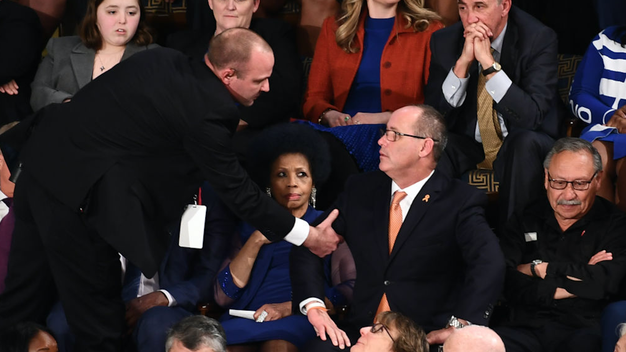 Fred Guttenberg(C), who lost his 14-year-old daughter in the Parkland, Florida, school shooting is removed after yelling during the State of the Union address at the US Capitol in Washington, DC, on February 4, 2020.