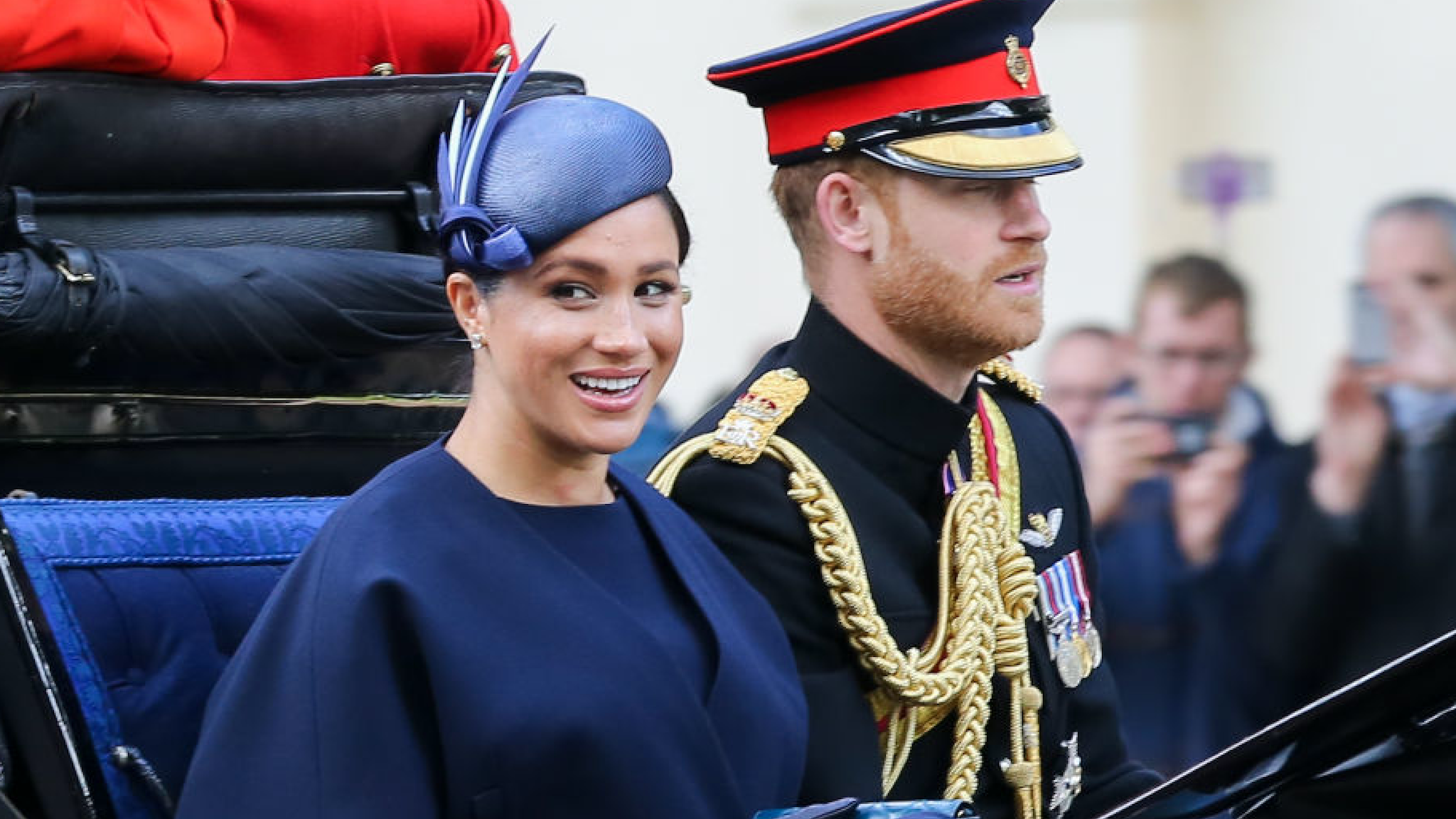 Meghan Duchess of Sussex and Prince Harry are seen in a carriage on their way to Buckingham Palace after attending the Trooping the Colour ceremony, which marks the 93rd birthday of, Queen Elizabeth II, Britain's longest reigning monarch.
