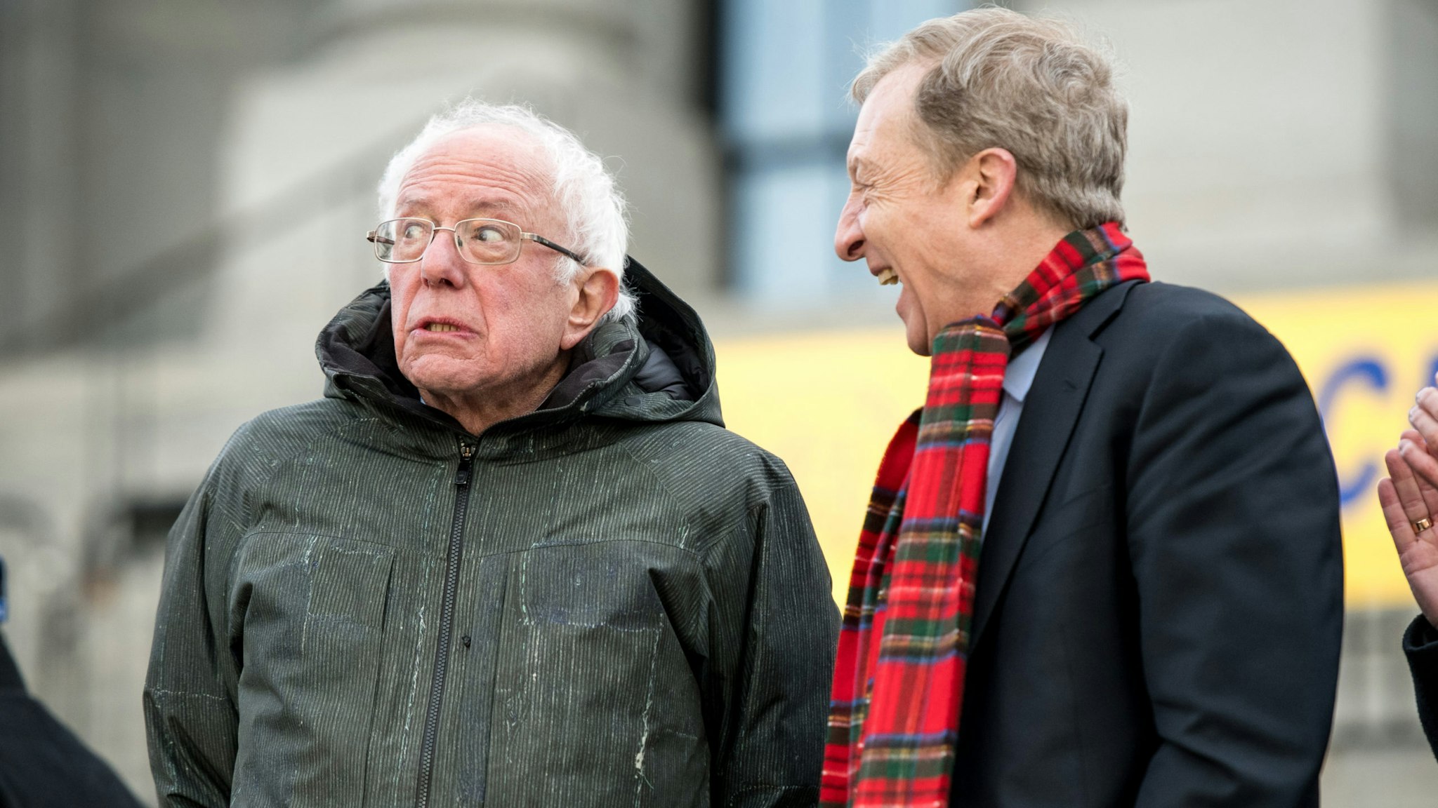 COLUMBIA, SC - JANUARY 20: Democratic presidential candidates, Sen. Bernie Sanders (I-VT), left, reacts to a conversation with Tom Steyer during the King Day at the Dome rally on January 20, 2020 in Columbia, South Carolina. The event, first held in 2000 in opposition to the display of the Confederate battle flag at the statehouse, attracted more than a handful Democratic presidential candidates looking for votes in the early primary state.
