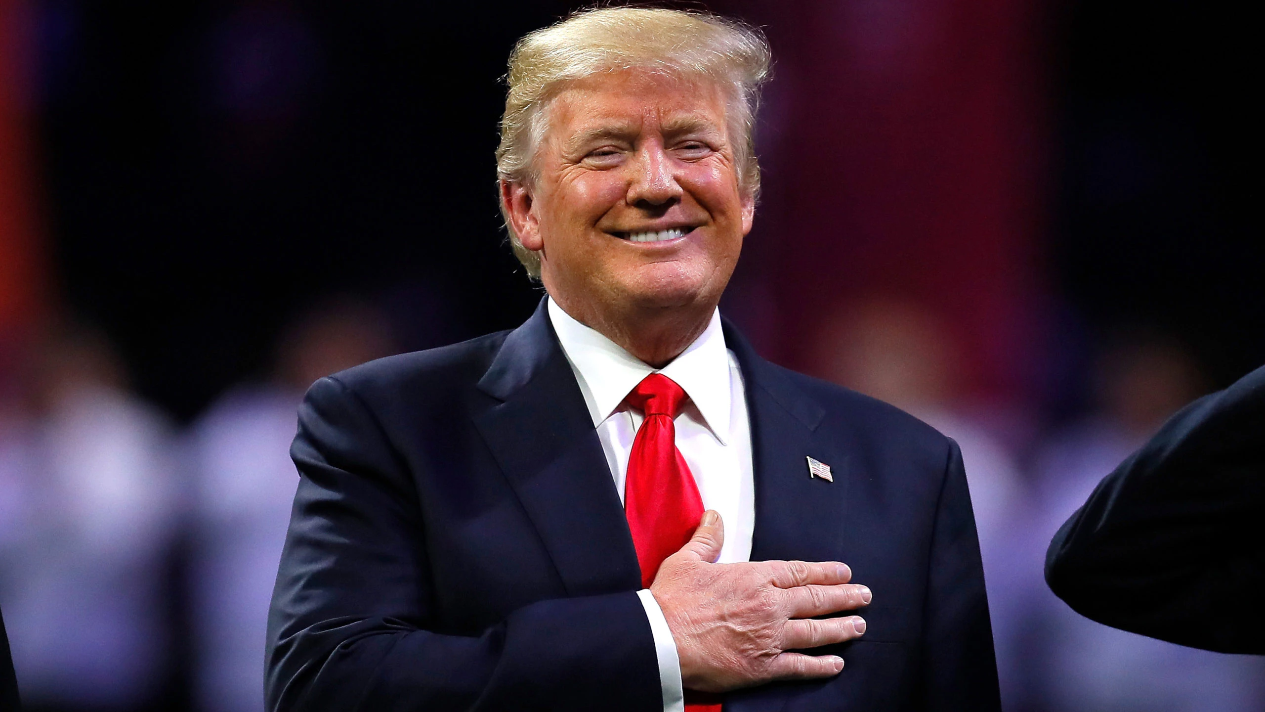 ATLANTA, GA - JANUARY 08: U.S. President Donald Trump on field during the national anthem prior to the CFP National Championship presented by AT&amp;T between the Georgia Bulldogs and the Alabama Crimson Tide at Mercedes-Benz Stadium on January 8, 2018 in Atlanta, Georgia.