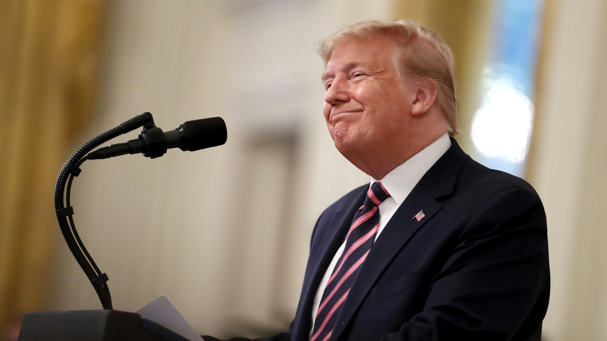 U.S. President Donald Trump smiles during an event at the White House in Washington, D.C., U.S., on Thursday, Feb. 6, 2020. Trump's acquittal by the Senate delivered an expected yet exhilarating victory to the White House, freeing a president who has for years operated under the threat of impeachment and longed for vindication.