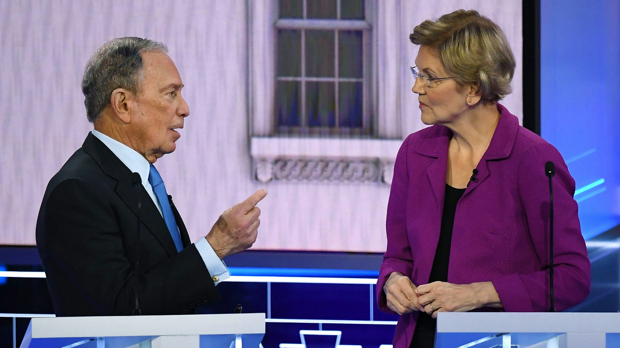 Democratic presidential hopefuls Former New York Mayor Mike Bloomberg and Massachusetts Senator Elizabeth Warren speak during a break in the ninth Democratic primary debate of the 2020 presidential campaign season co-hosted by NBC News, MSNBC, Noticias Telemundo and The Nevada Independent at the Paris Theater in Las Vegas, Nevada, on February 19, 2020.