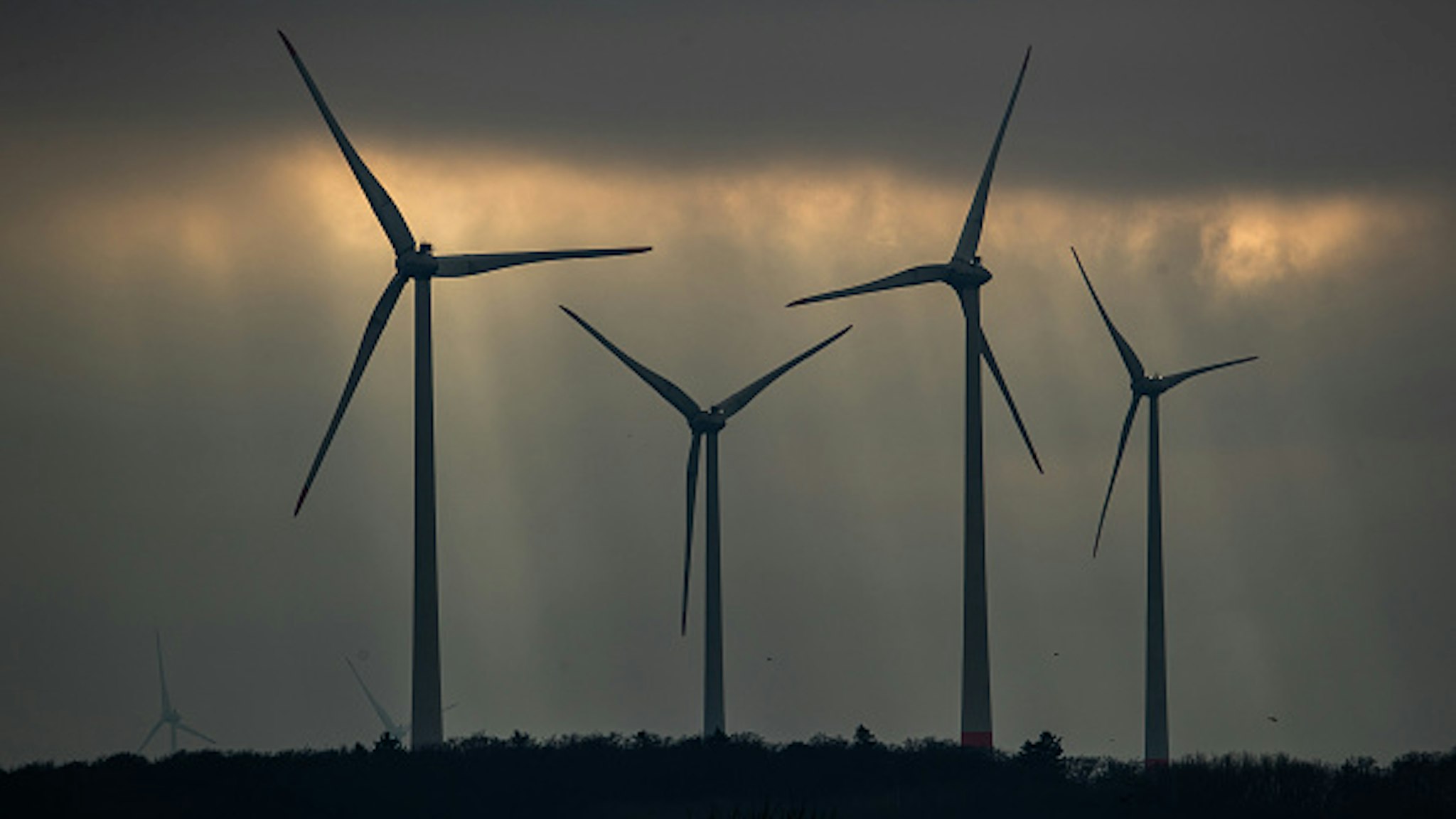 23 January 2020, North Rhine-Westphalia, Altenbeken: Wind turbines can be seen against a cloudy sky.