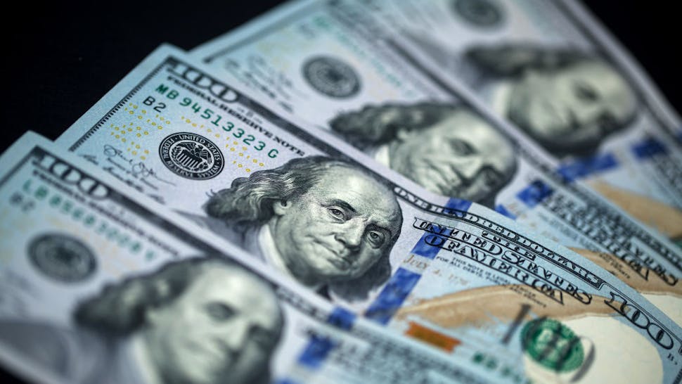 100 Dollar Bills U.S. one-hundred dollar banknotes are arranged for a photograph in Hong Kong, China, on Monday, April 15, 2019. China's holdings of Treasury securities rose for a third month as the Asian nation took on more U.S. government debt amid the trade war between the worlds two biggest economies. Photographer: Paul Yeung/Bloomberg via Getty Images