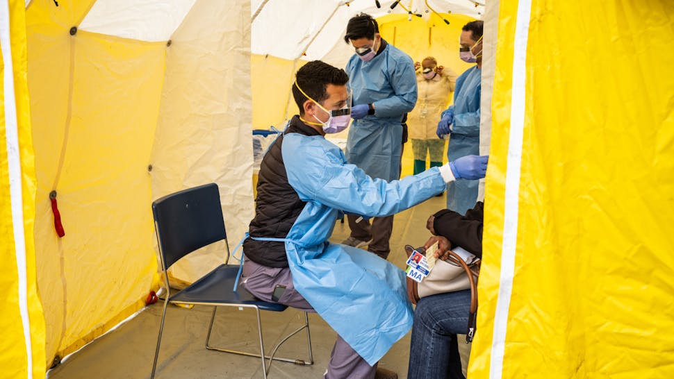 Doctors test hospital staff with flu-like symptoms for COVID-19 at St. Barnabas hospital on March 20, 2020 in New York City.
