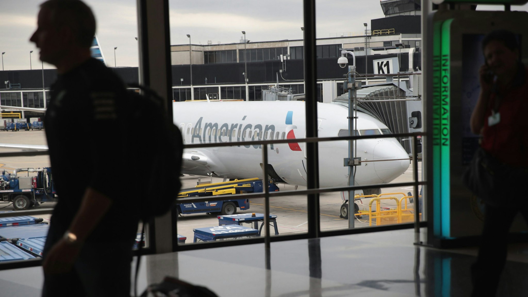 An American Airlines aricraft sits at a gate at O'Hare International Airport on May 11, 2018 in Chicago, Illinois.