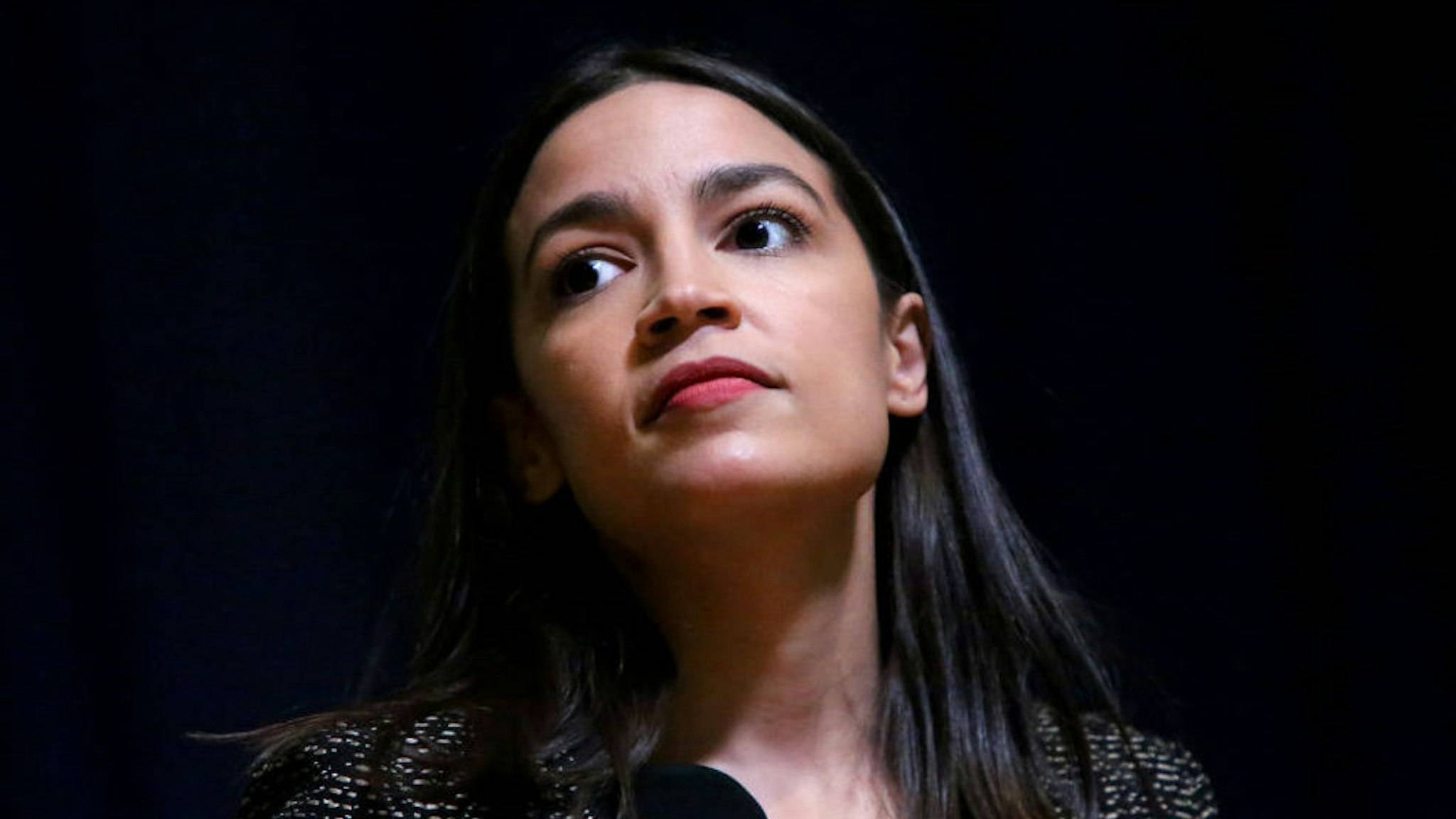 Rep. Alexandria Ocasio-Cortez (D-NY) takes questions during a Green New Deal For Public Housing Town Hall on December 14, 2019 in the Queens borough of New York City. (Photo by Yana Paskova/Getty Images)