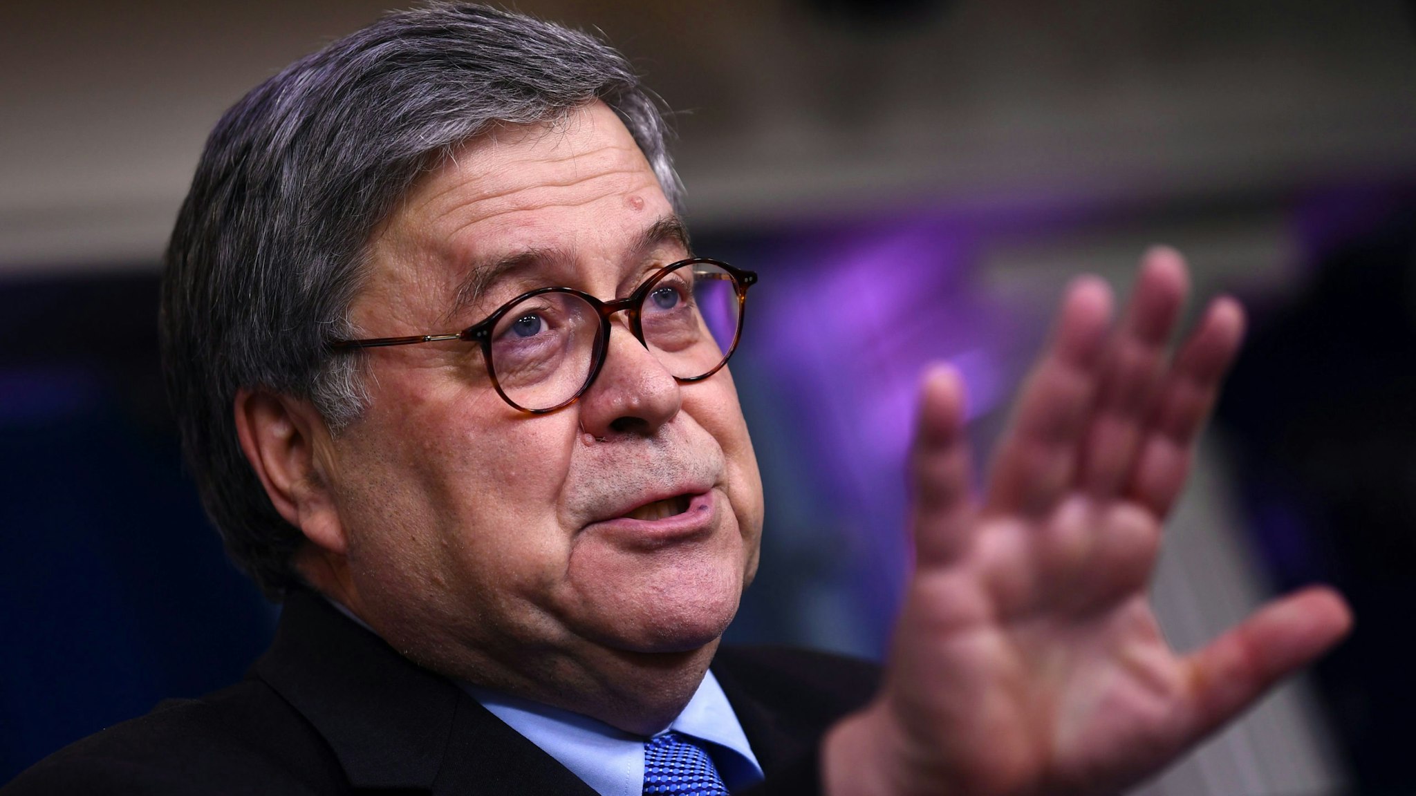US Attorney General William Barr gestures as he speaks during the daily briefing on the novel coronavirus, COVID-19, at the White House, March 23, 2020, in Washington, DC.