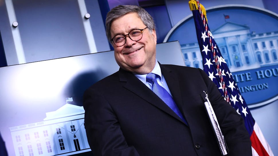 US-HEALTH-VIRUS-BRIEFING US President Donald Trump arrives as Attorney General William Barr looks on during the daily briefing on the novel coronavirus, COVID-19, at the White House on March 23, 2020, in Washington, DC.