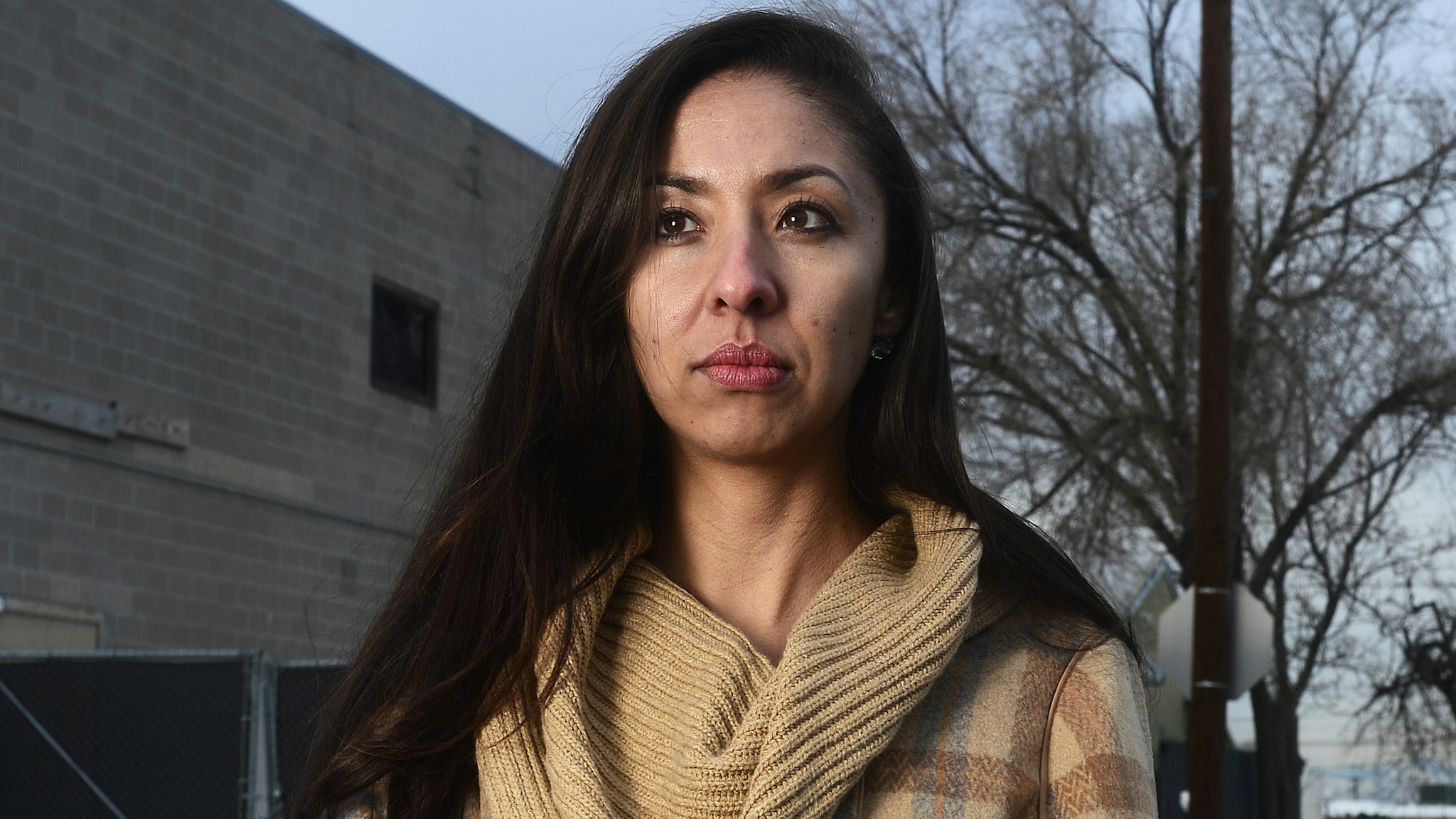 DENVER, CO - DECEMBER 22: Community organizer Candi CdeBaca stands outside of a warehouse that was in use as a marijuana grow facility December 22, 2015 in Denver, Colorado. CdeBaca is part of a group that is against the amount of marijuana operations in low income and heavily minority neighborhoods. One of the fears of the legalization of marijuana was that pot businesses would find places to call home in low income, mostly minority neighborhoods, which according to some is exactly what happened.