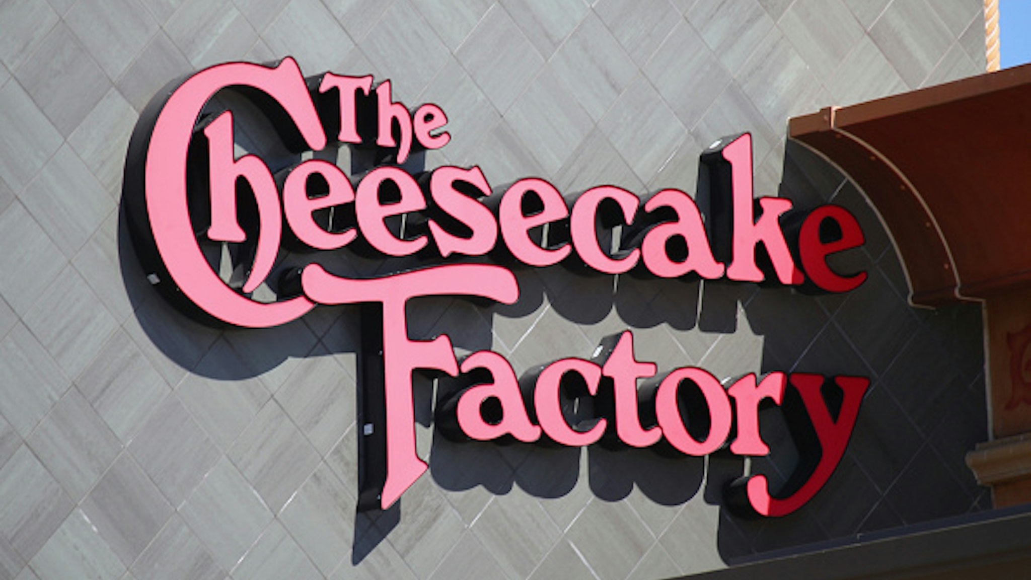 HUNTINGTON STATION, NEW YORK - MARCH 26: A general view of the Cheesecake Factory logo on their restaurant in the Walt Whitman Mall on March 26, 2020 in Huntington Station, New York. Across the country schools, businesses and places of work have either been shut down or are restricting hours of operation as health officials try to slow the spread of COVID-19.