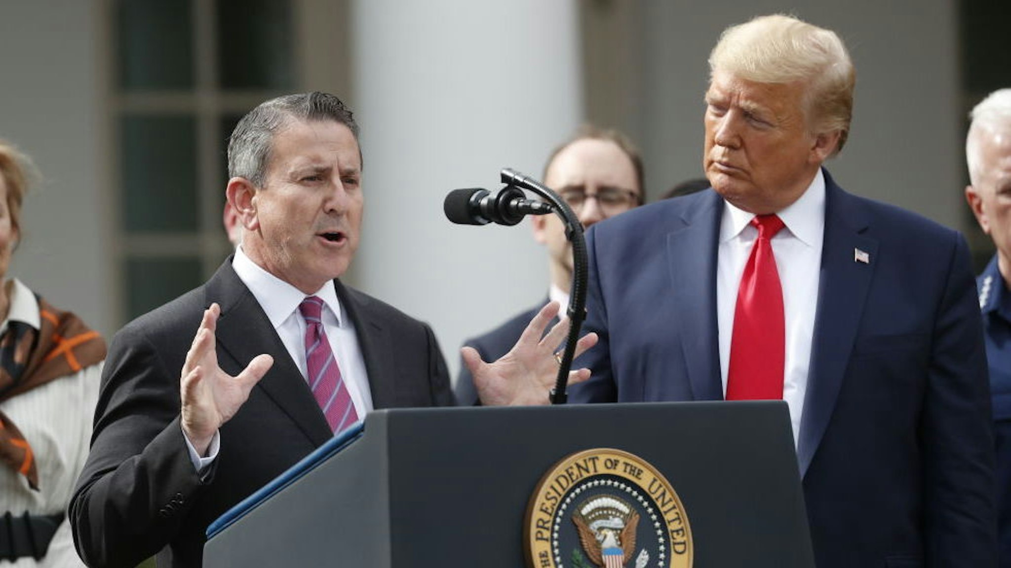 Brian Cornell, chief executive officer and chairman of Target Corp., left, speaks during a news conference with U.S. President Donald Trump in the Rose Garden of the White House in Washington, D.C., U.S., on Friday, March 13, 2020. Trump declared a national emergency over the coronavirus outbreak to allow for more federal aid for states and municipalities. Photographer: Andrew Harrer/Bloomberg
