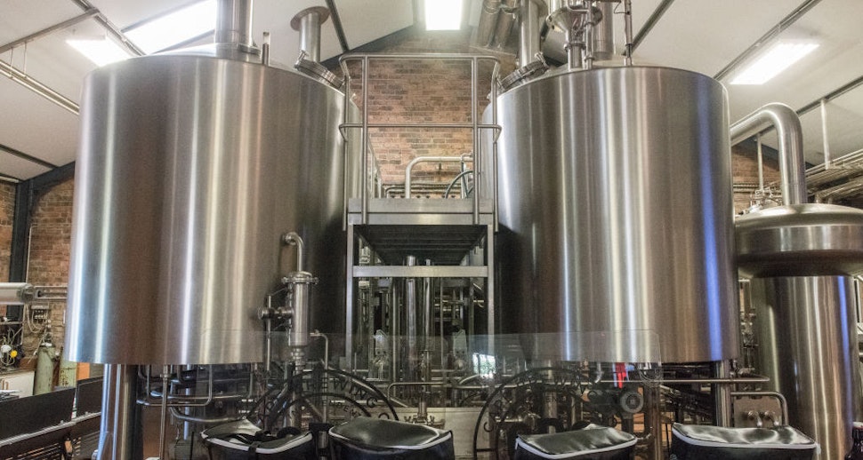 Two metal storage vats containing beer at microbrewery, Cape Town, South Africa. (Photo by: Edwin Remsberg/VW PICS/UIG via Getty Image)