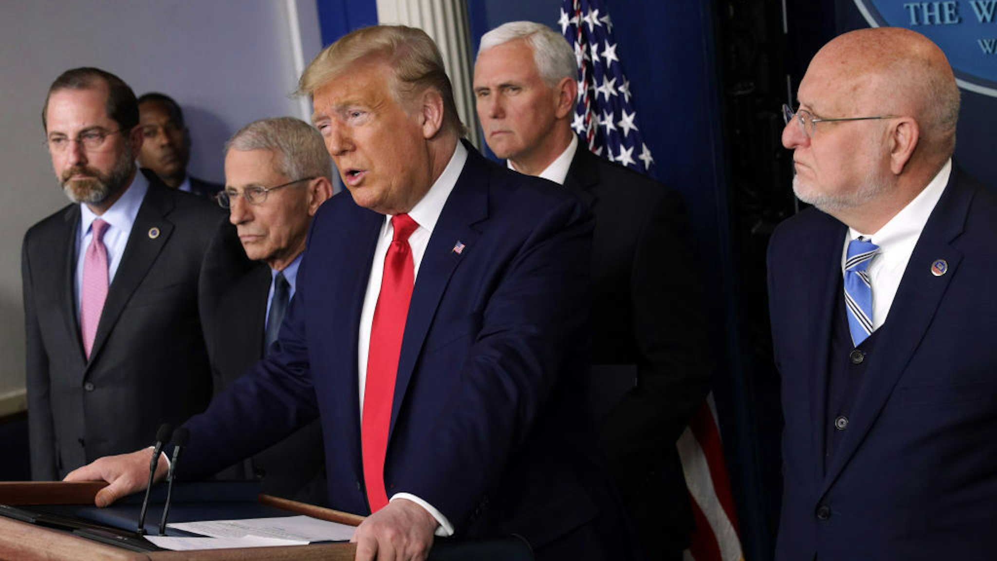 U.S. President Donald Trump speaks as Health and Human Services Secretary Alex Azar, National Institute for Allergy and Infectious Diseases Director Anthony Fauci, Vice President Mike Pence, and Centers for Disease Control and Prevention Director Robert Redfield listen during a news conference at the James Brady Press Briefing Room at the White House February 29, 2020 in Washington, DC. Department of Health in Washington State has reported the first death in the U.S. related to the coronavirus. (Photo by Alex Wong/Getty Images)
