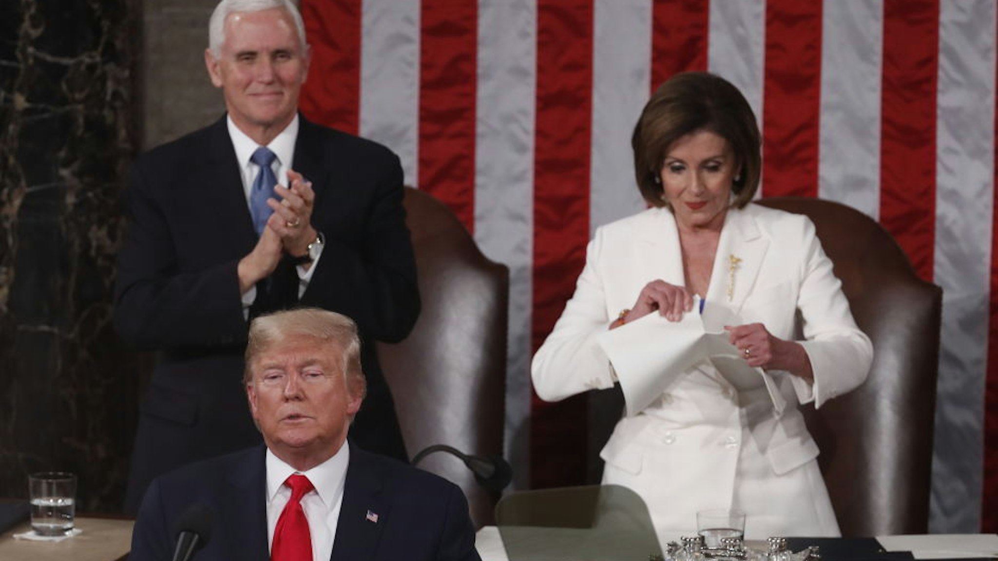 Speaker of the House Nancy Pelosi, a Democrat from California, right, rips up papers after U.S. President Donald Trump, bottom left, delivers a State of the Union address to a joint session of Congress at the U.S. Capitol in Washington, D.C., U.S., on Tuesday, Feb. 4, 2020. President Donald Trump will try to move past his impeachment and make a case for his re-election in Tuesday's State of the Union address by taking credit for a strong economy, newly signed trade deals and an immigration crackdown. Photographer: Andrew Harrer/Bloomberg