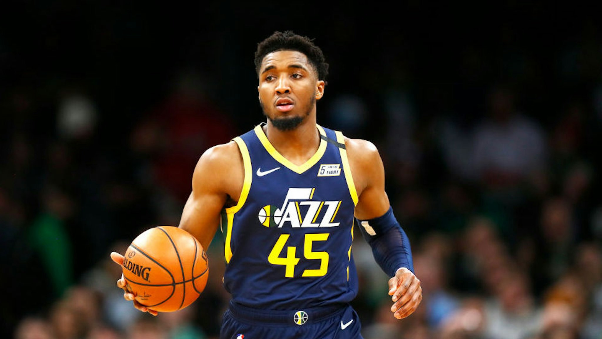 Donovan Mitchell #45 of the Utah Jazz brings the ball up court during the third quarter of the game against the Boston Celtics at TD Garden on March 06, 2020 in Boston, Massachusetts. NOTE TO USER: User expressly acknowledges and agrees that, by downloading and or using this photograph, User is consenting to the terms and conditions of the Getty Images License Agreement. (Photo by Omar Rawlings/Getty Images)