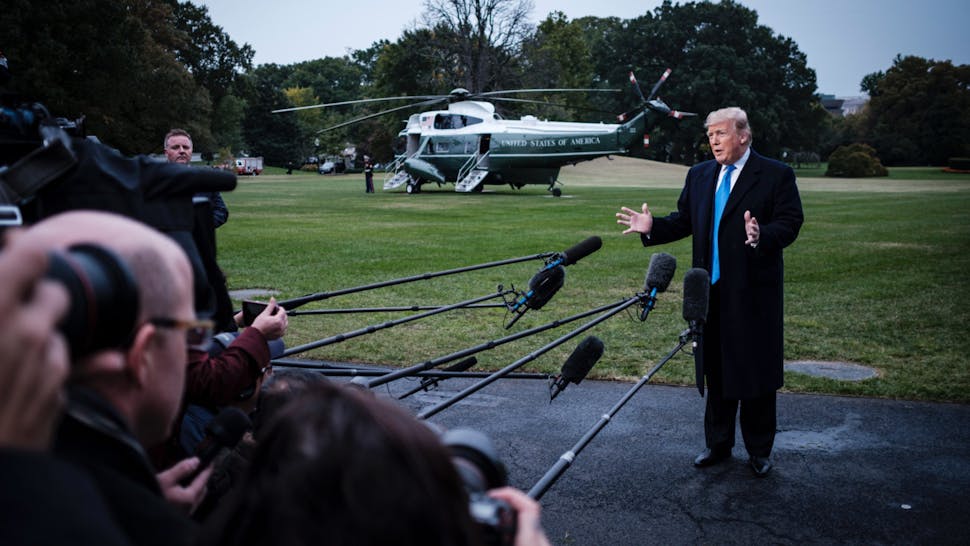 Donald Trump US President Donald Trump speaks to the media as he prepares to board Marine One on the South Lawn of the White House on October 26, 2018 in Washington, DC.