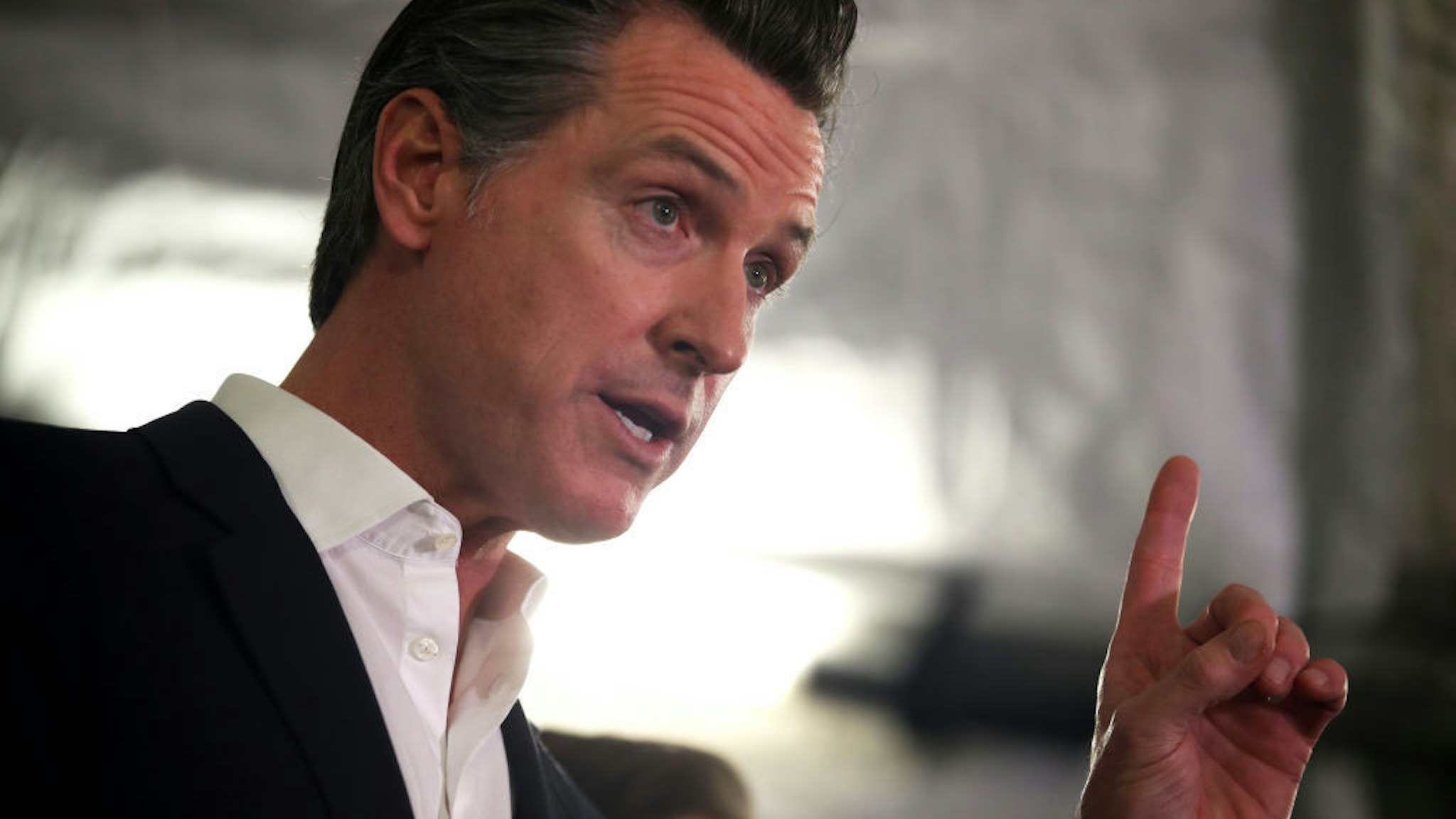 California Gov. Gavin Newsom speaks during a a news conference about the state's efforts on the homelessness crisis on January 16, 2020 in Oakland, California. Newsom was joined by Oakland Mayor Libby Schaaf to announce that Oakland will receive 15 unused FEMA trailers for the city to use as temporary housing and as mobile health and social services clinics for the homeless. Newsom signed on executive order on January 8 to deploy 100 trailers and crisis response teams to areas in need across the state. (Photo by Justin Sullivan/Getty Images)