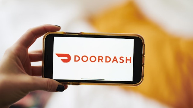Doordash Inc. signage is displayed on an Apple Inc. iPhone in an arranged photograph taken in the Brooklyn borough of New York, U.S., on Friday, Jan. 10, 2020.