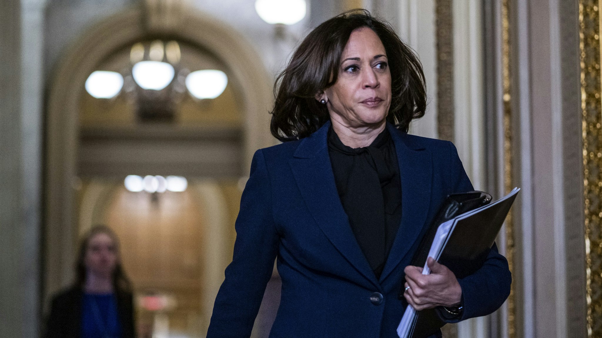 WASHINGTON, DC - JANUARY 31: Sen. Kamala Harris (D-CA) walks near the Senate Chamber during a recess in the Senate impeachment trial of U.S. President Donald Trump at the U.S. Capitol on January 31, 2020 in Washington, DC. On Friday, Senators are expected to debate and then vote on whether to include additional witnesses and documents. (Photo by Zach Gibson/Getty Images)