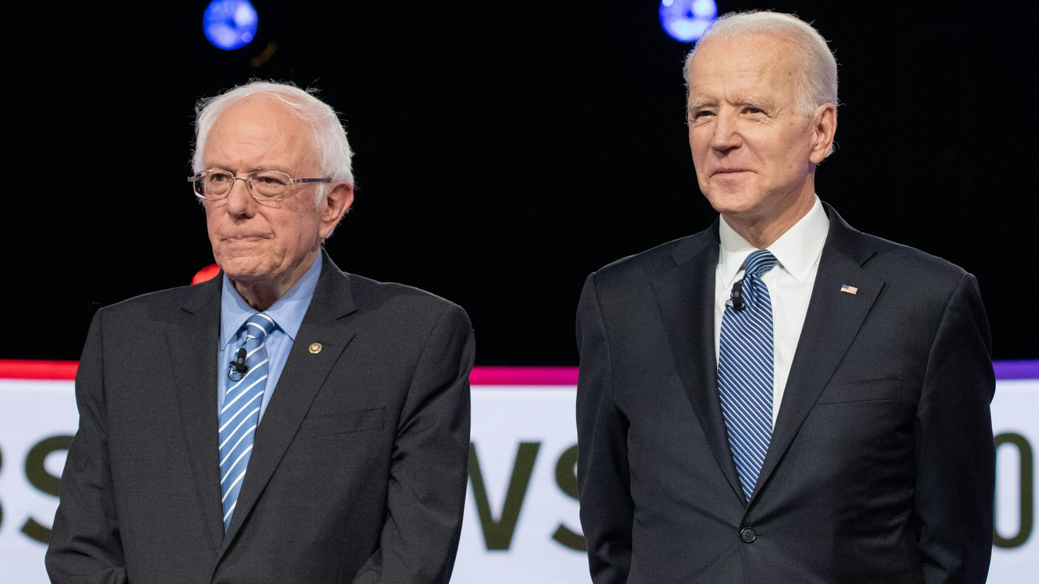 2020 presidential candidates Senator Bernie Sanders, an Independent from Vermont, left, and former Vice President Joe Biden arrive on stage ahead of the Democratic presidential debate in Charleston, South Carolina, U.S., on Tuesday, Feb. 25, 2020. Michael Bloomberg is trying for a do-over in Tuesdays Democratic presidential debate, previewing that hell turn his focus to newly minted front-runner Bernie Sanders after a much-criticized debut at last weeks face-off.
