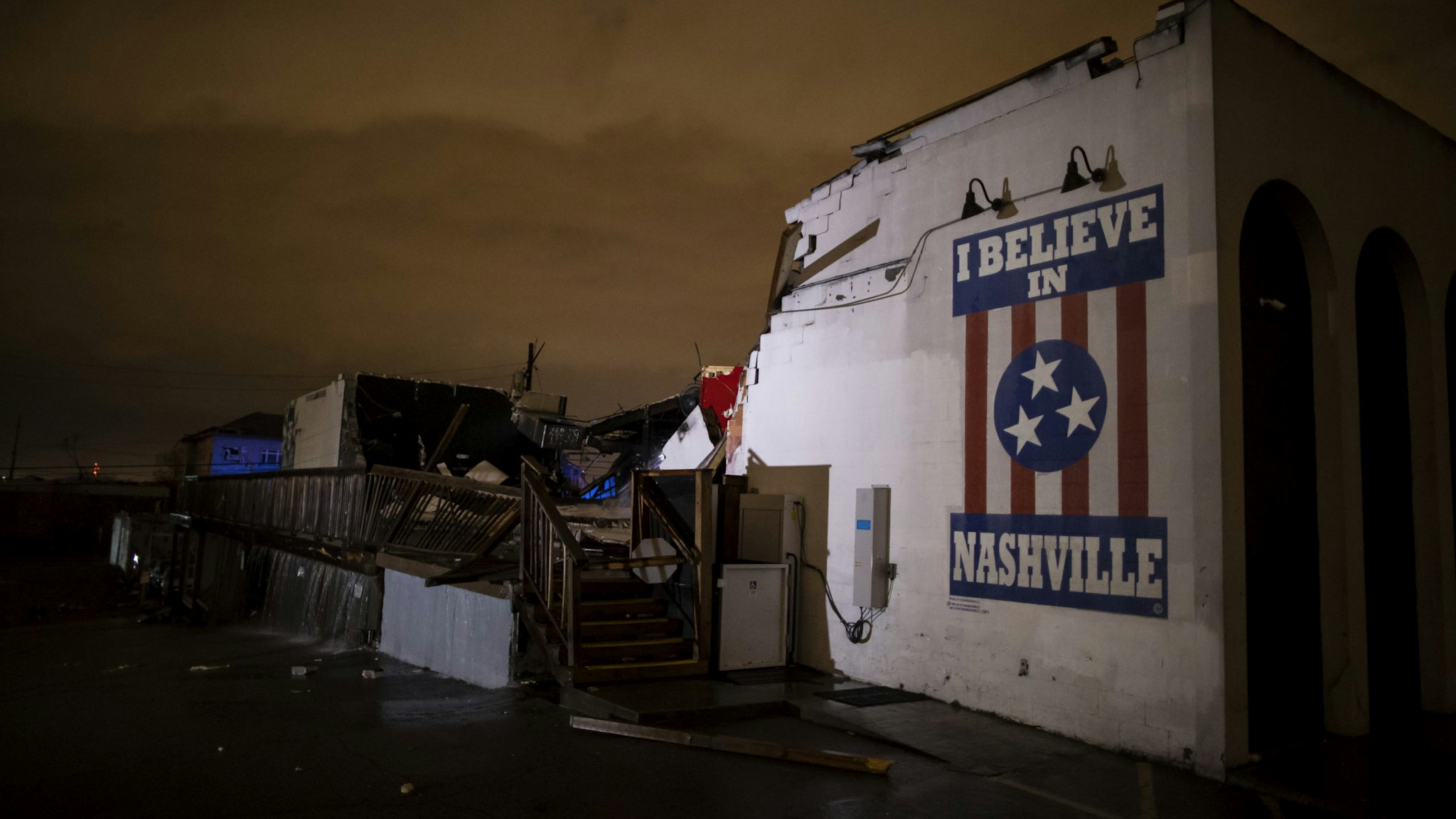 NASHVILLE, TN - MARCH 03: General view of a mural on heavily damaged The Basement East in the East Nashville neighborhood on March 3, 2020 in Nashville, Tennessee. A tornado passed through Nashville just after midnight leaving a wake of damage in its path including two people killed in East Nashville. (Photo by Brett Carlsen/Getty Images)