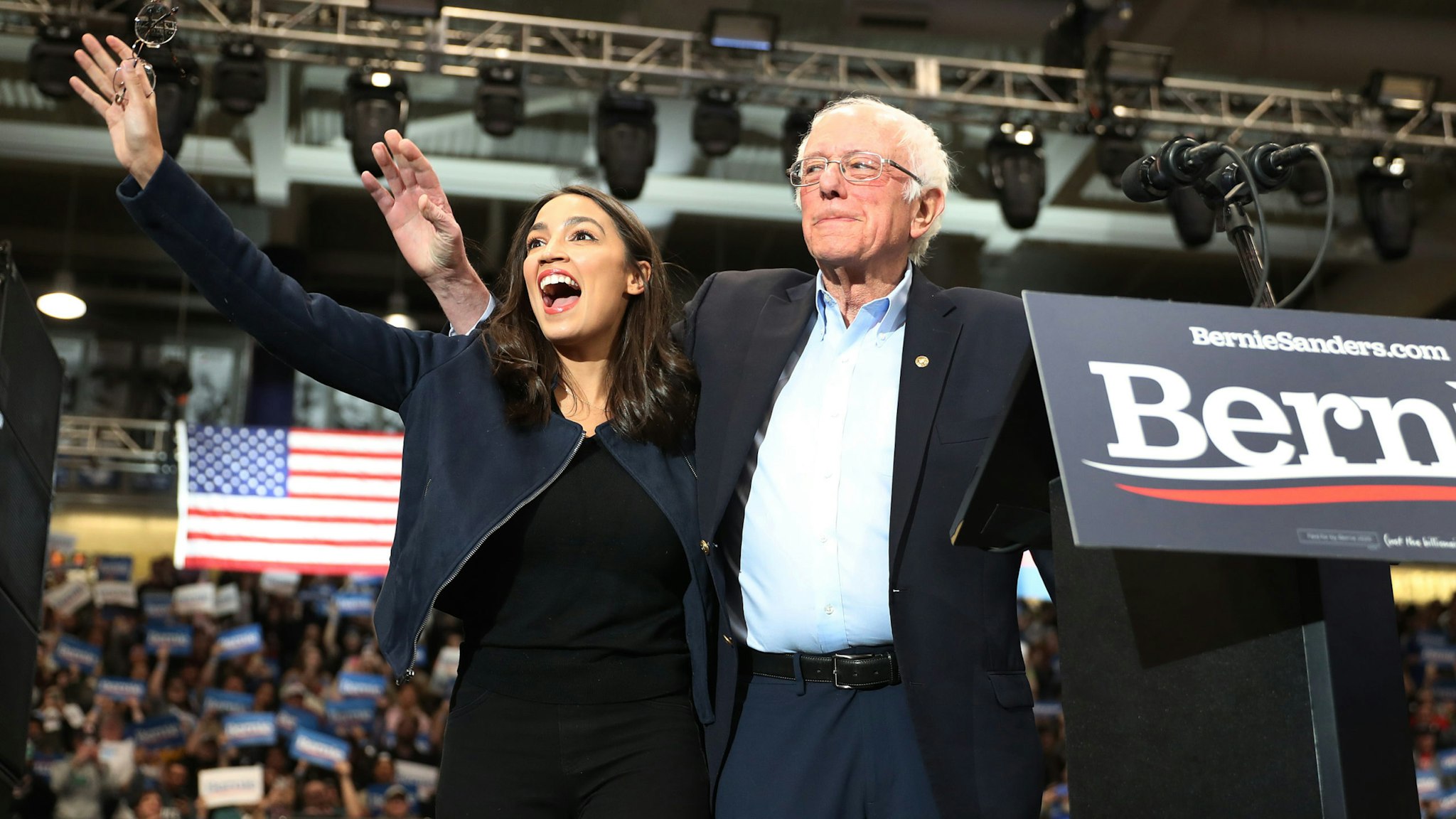 DURHAM, NEW HAMPSHIRE - FEBRUARY 10: U.S. Rep. Alexandria Ocasio-Cortez (D-N.Y) and Democratic presidential candidate Sen. Bernie Sanders (I-VT) stand together during his campaign event at the Whittemore Center Arena on February 10, 2020 in Durham, New Hampshire. The state's Democratic primary is tomorrow. (Photo by Joe Raedle/Getty Images)