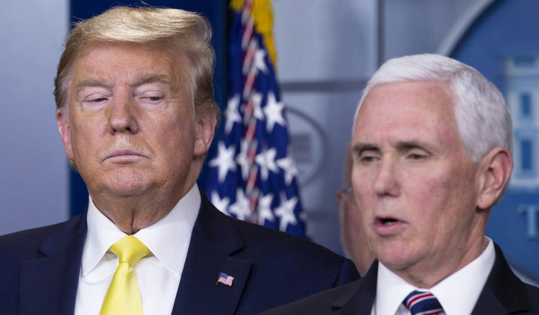 U.S. President Donald Trump, left, listens as Vice President Mike Pence speaks during a news conference in Washington, D.C., U.S., on Monday, March 9, 2020.