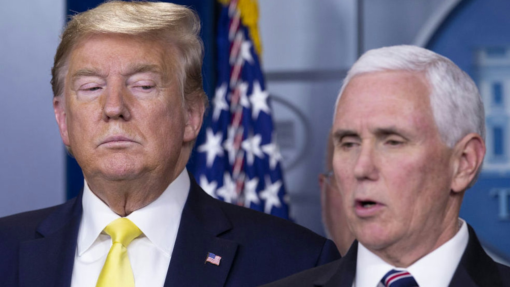 U.S. President Donald Trump, left, listens as Vice President Mike Pence speaks during a news conference in Washington, D.C., U.S., on Monday, March 9, 2020.