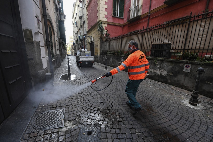 APLES, CAMPANIA, ITALY - 2020/03/31: Sanitary workers disinfect the streets of Naples city to counter the danger of a coronavirus infection (COVID 19). (Photo by Salvatore Laporta/KONTROLAB/LightRocket via Getty Images)