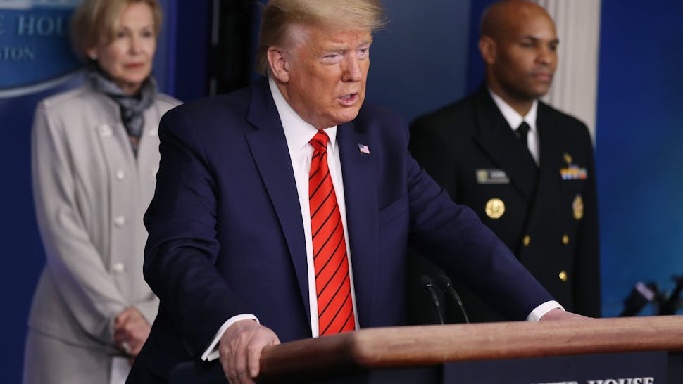 Trump coronavirus WASHINGTON, DC - MARCH 19: U.S. President Donald Trump speaks speaks on the latest developments of the coronavirus outbreak, while flanked by White House coronavirus response coordinator Debbie Birx (L), and U.S. Surgeon General Jerome Adams (R), in the James Brady Press Briefing Room at the White House March 19, 2020 in Washington, DC. With Americans testing positive for the coronavirus rising, President Trump is asking Congress for $1 trillion aid package to deal with the COVID-19 pandemic. (Photo by Chip Somodevilla/Getty Images)