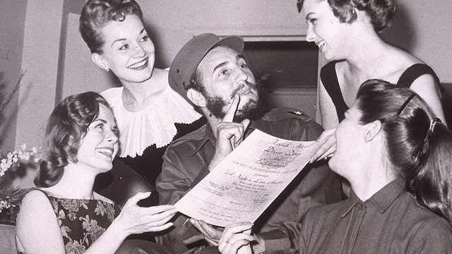 Cuban leader Fidel Castro is presented with an invitation to the New York Press Photographer's Ball, New York City,