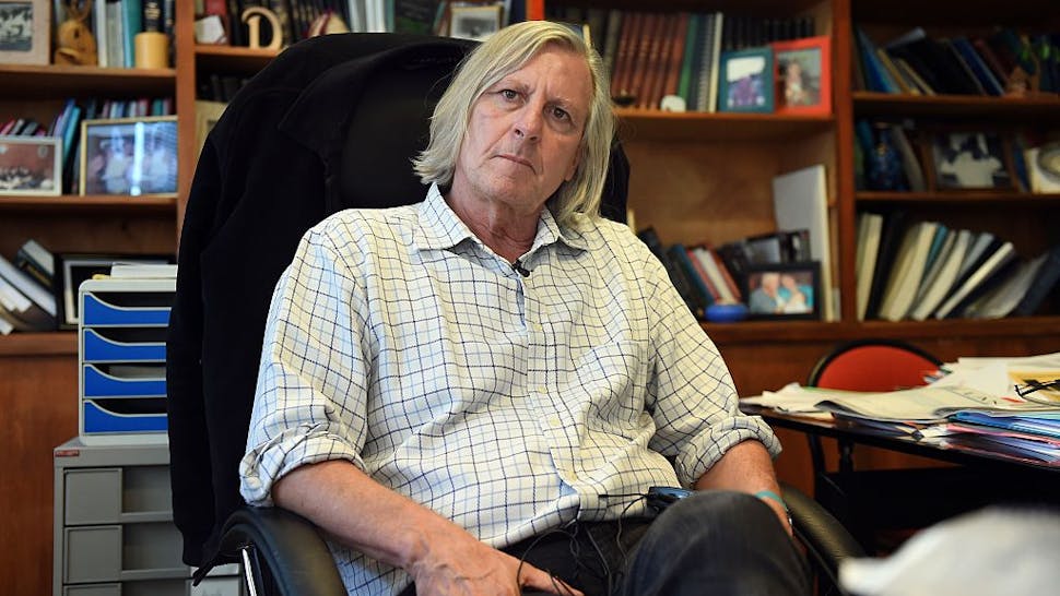 FRANCE-HEALTH-MEDICINE-AIDS-RESEARCH Didier Raoult, Professor at the Faculty of Medicine of Marseille, poses on November 6, 2014 in his office at the Facutly of Medicine in Marseille, southern France.