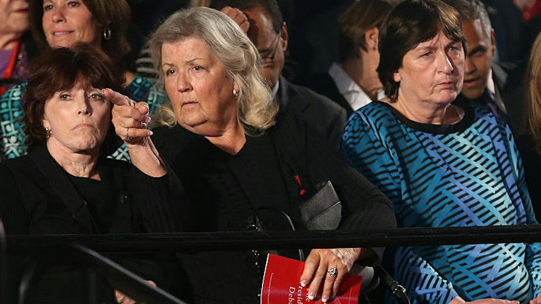 Three of the four woman who sat with Donald Trump in a press conference and made several accusations against Bill and Hillary Clinton -- Kathleen Wiley (left), Juanita Broaddrick (center), and Kathy Shelton -- attend the presidential debate on Sunday, Oct. 9, 2016 at Washington University in St. Louis, Mo.