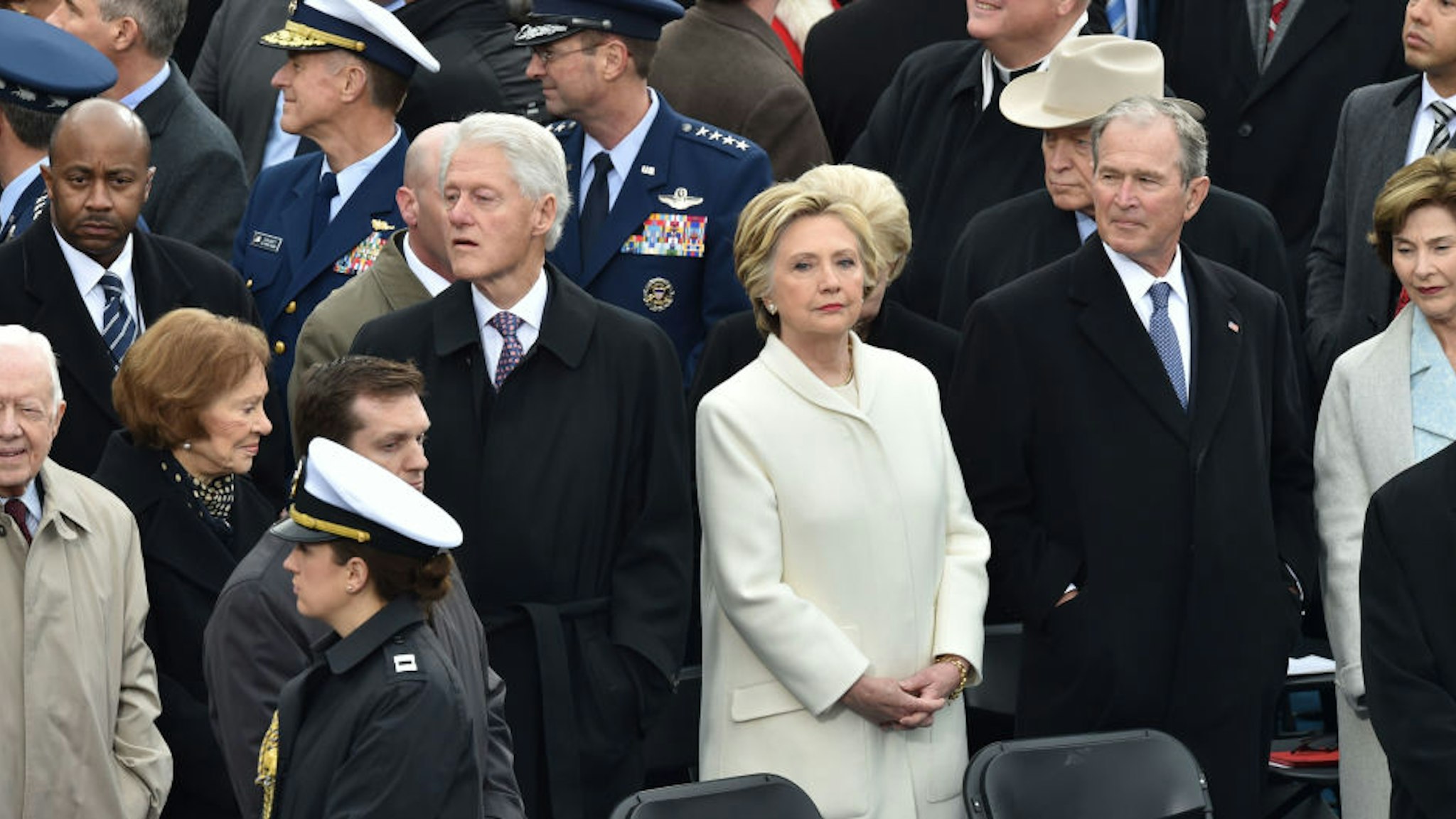 Former Us President Bill Clinton(L), former US President Jimmy Carter(L) former US President George W. Bush(2ndR) and Hillary Clinton(C) arrive on the platform of the US Capitol in Washington, DC, on January 20, 2017,