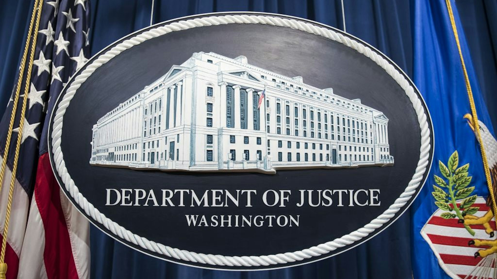 The Department of Justice logo hangs as the backdrop before a press conference held by Attorney General Jeff Sessions on leaks of classified material threatening national security in Washington, USA on August 4, 2017.
