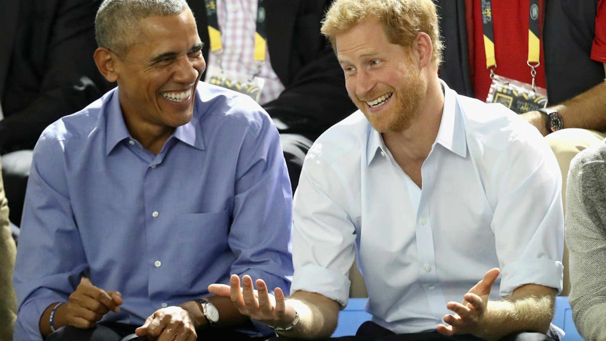 Former U.S. President Barack Obama and Prince Harry share a joke as they watch wheelchair baskeball on day 7 of the Invictus Games 2017 on September 29, 2017 in Toronto, Canada