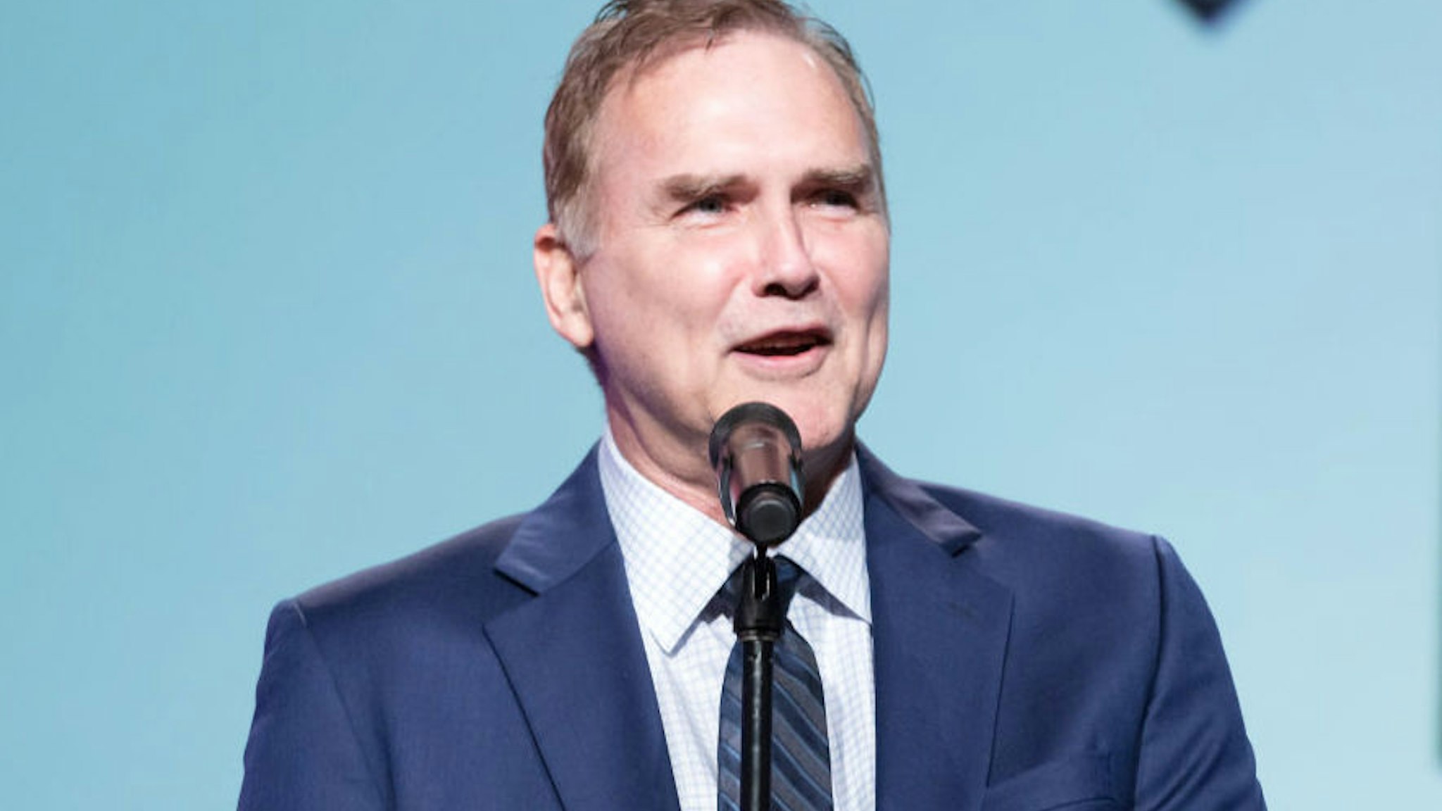 Comedian Norm MacDonald performs on stage at the Saban Community Clinic's 50th Anniversary Dinner Gala at The Beverly Hilton Hotel on November 13, 2017 in Beverly Hills, California.