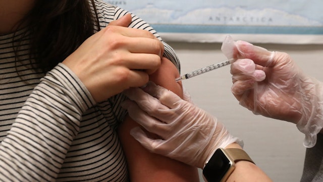 Simone Groper receives a flu shot at a Walgreens phramacy on January 22, 2018 in San Francisco, California.