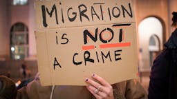 Demonstration Against Treatment Of Migrants By EU In Greece A demonstrator is seen taking part in a protest in front of the loacl EU representation in Warsaw, Poland on March 9, 2020. Several dozen people on Tuesday participate in a protest in front of the regional EU office in Warsaw against the treatment of refugees stuck at the Turkish border with Greece.