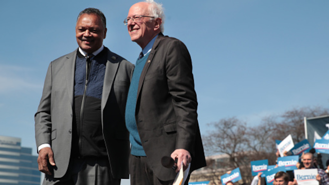 GRAND RAPIDS, MICHIGAN - MARCH 08: Democratic presidential candidate Sen. Bernie Sanders (I-VT) and Rev. Jesse Jackson greet the crowd during a campaign rally in Calder Plaza on March 08, 2020 in Grand Rapids, Michigan. Michigan holds its primary election on Tuesday March 10.
