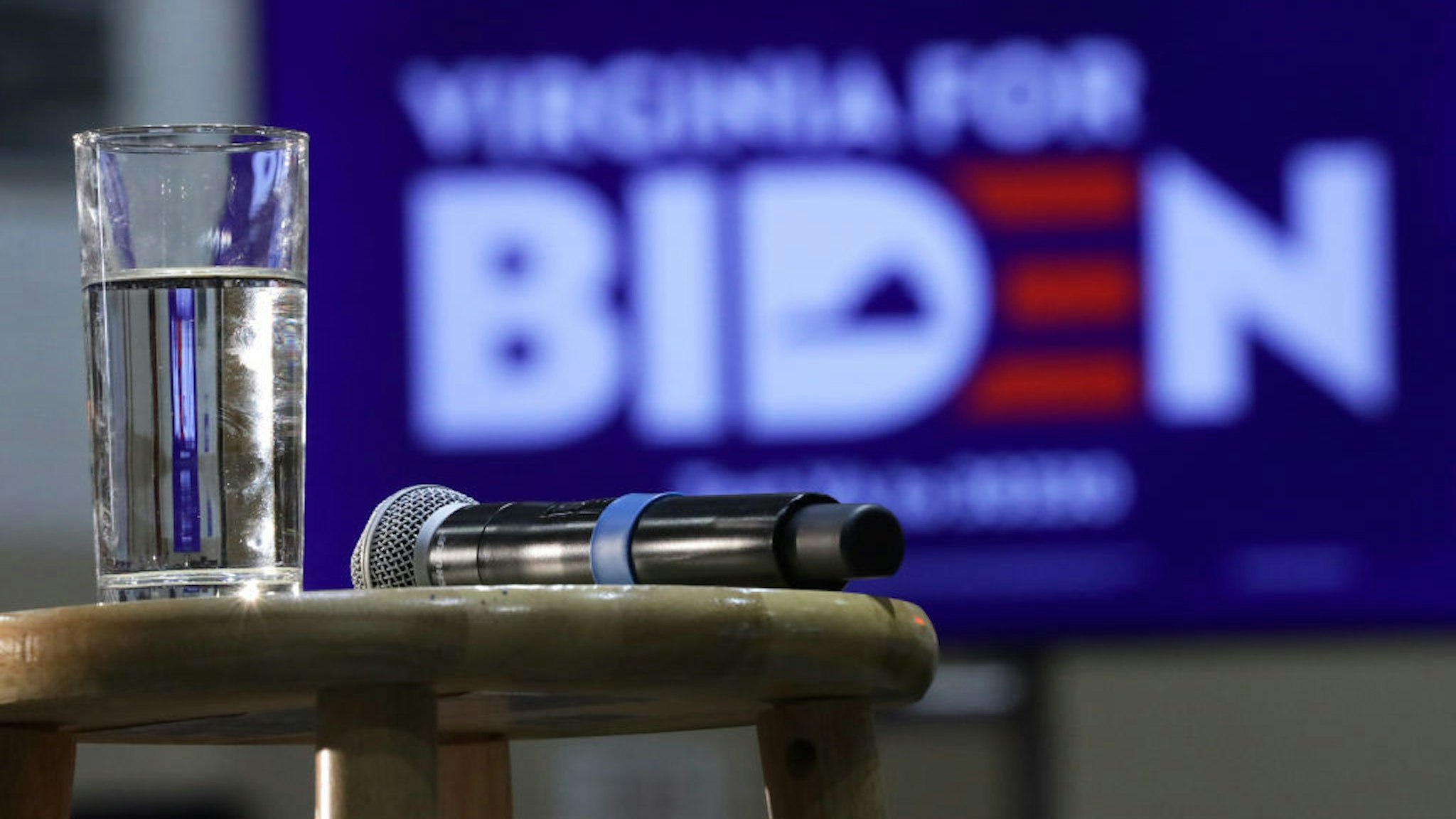 A microphone and a glass of water is placed on a stool prior to a campaign event of Democratic presidential candidate former Vice President Joe Biden at Booker T. Washington High School March 1, 2020 in Norfolk, Virginia. After his major win in South Carolina, Biden continues to campaign for the upcoming Super Tuesday Democratic presidential primaries. (Photo by Alex Wong/Getty Images)