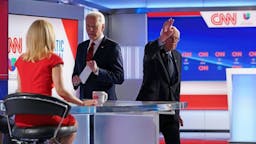 Joe Biden Bernie Sanders Democratic presidential hopeful former US vice president Joe Biden speaks to CNN news anchor Dana Bash as Senator Bernie Sanders leaves the stage after both men took part in the 11th Democratic Party 2020 presidential debate in a CNN Washington Bureau studio in Washington, DC on March 15, 2020. (Photo by MANDEL NGAN / AFP)