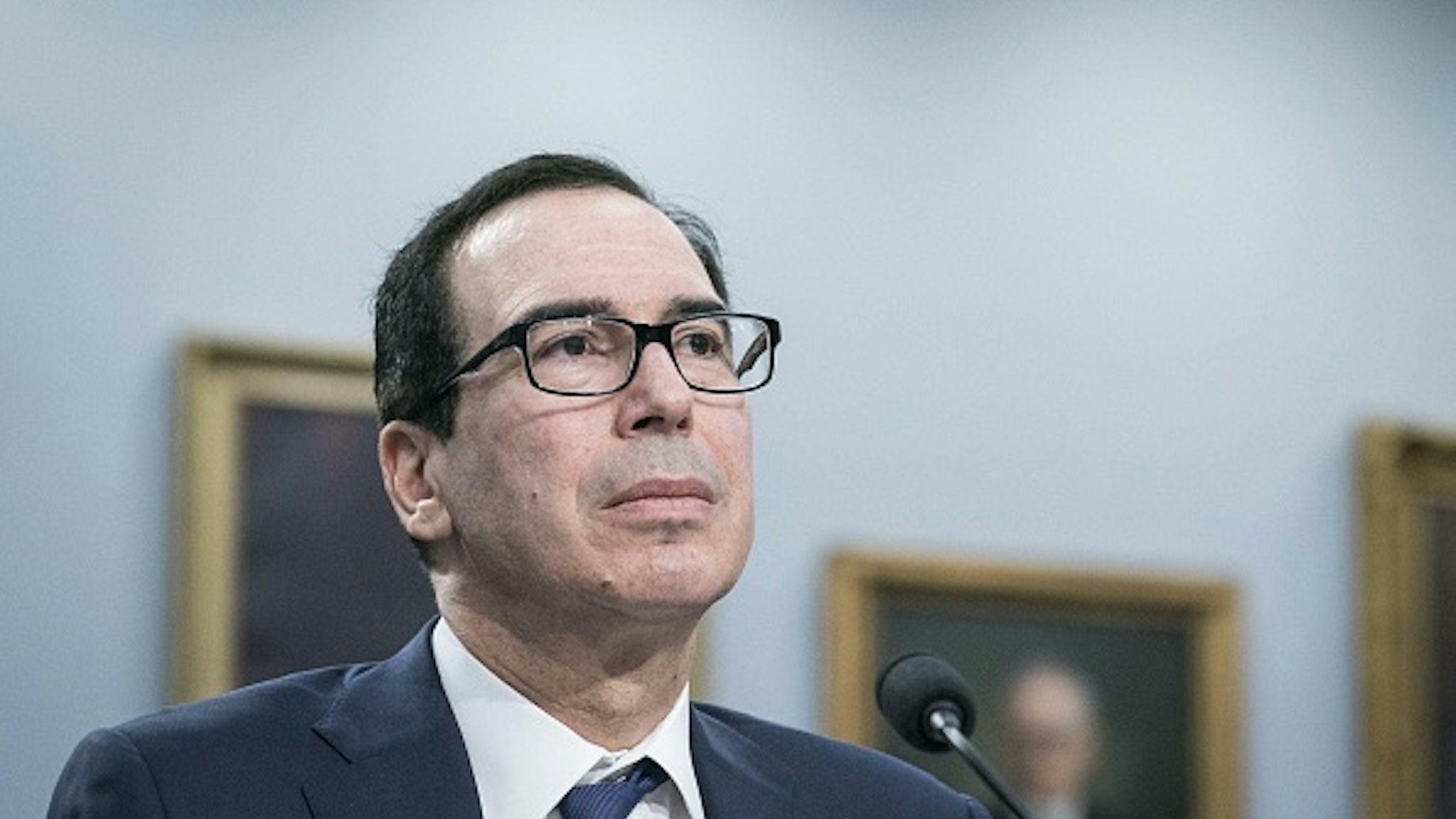 Steven Mnuchin, U.S. Treasury secretary, listens during a House Appropriations Committee hearing on Capitol Hill in Washington, D.C., U.S., on Wednesday, March 11, 2020. Mnuchin said he supports extending the 2019 tax-filing deadline beyond April 15 to provide relief from economic disruption caused by the coronavirus outbreak, and he'll recommend that step to President Donald Trump.