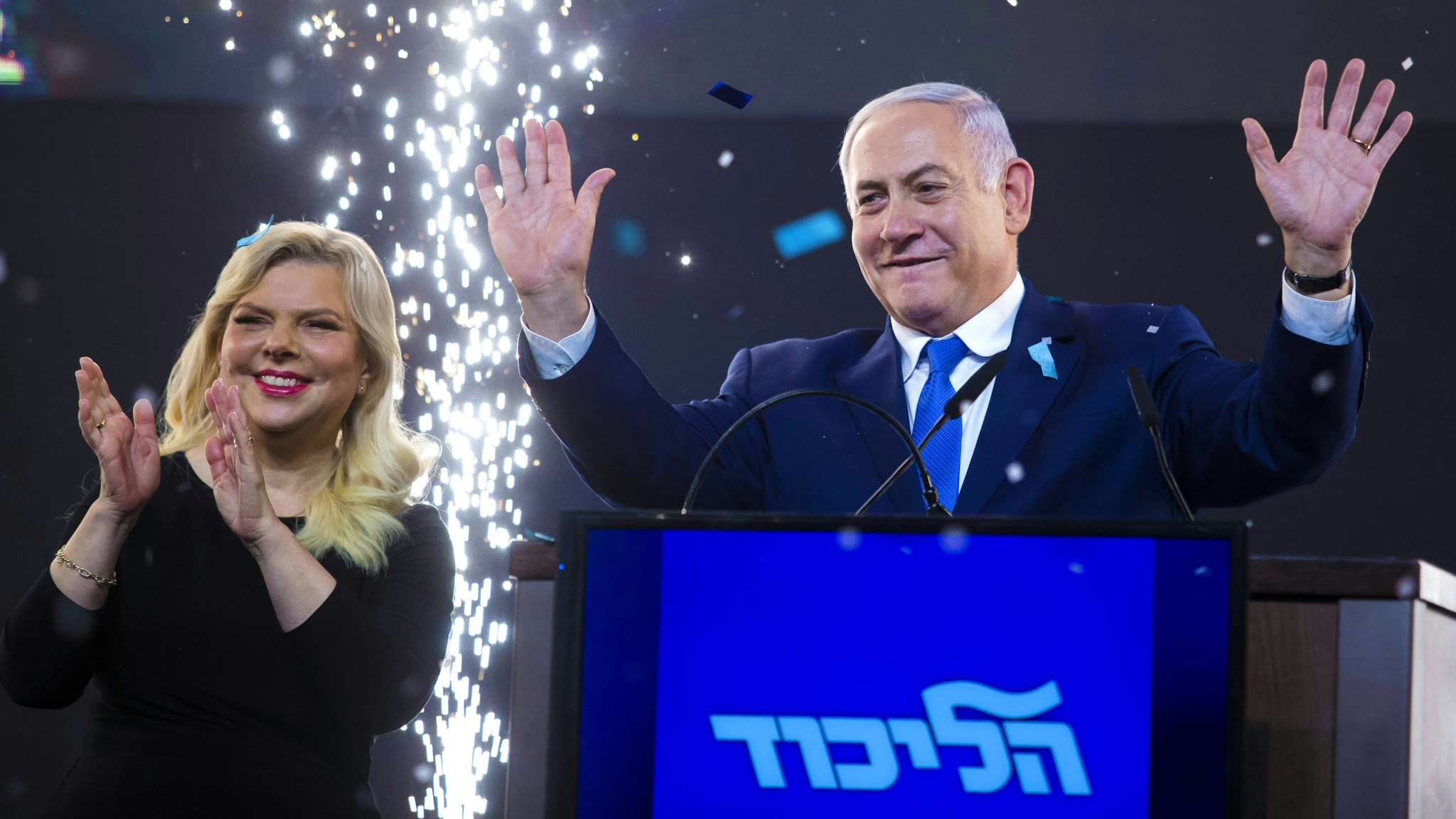 TEL AVIV, ISRAEL - APRIL 10: Prime Minster of Israel, Benjamin Netanyahu and his wife, Sara greet supporters during his after vote speech on April 10, 2019 in Tel Aviv, Israel. Prime Minister Benjamin Netanyahu and Blue and White leader Benny Gantz each declared that they won Tuesday's election after inconclusive exit polls were broadcast on the three Israeli networks.