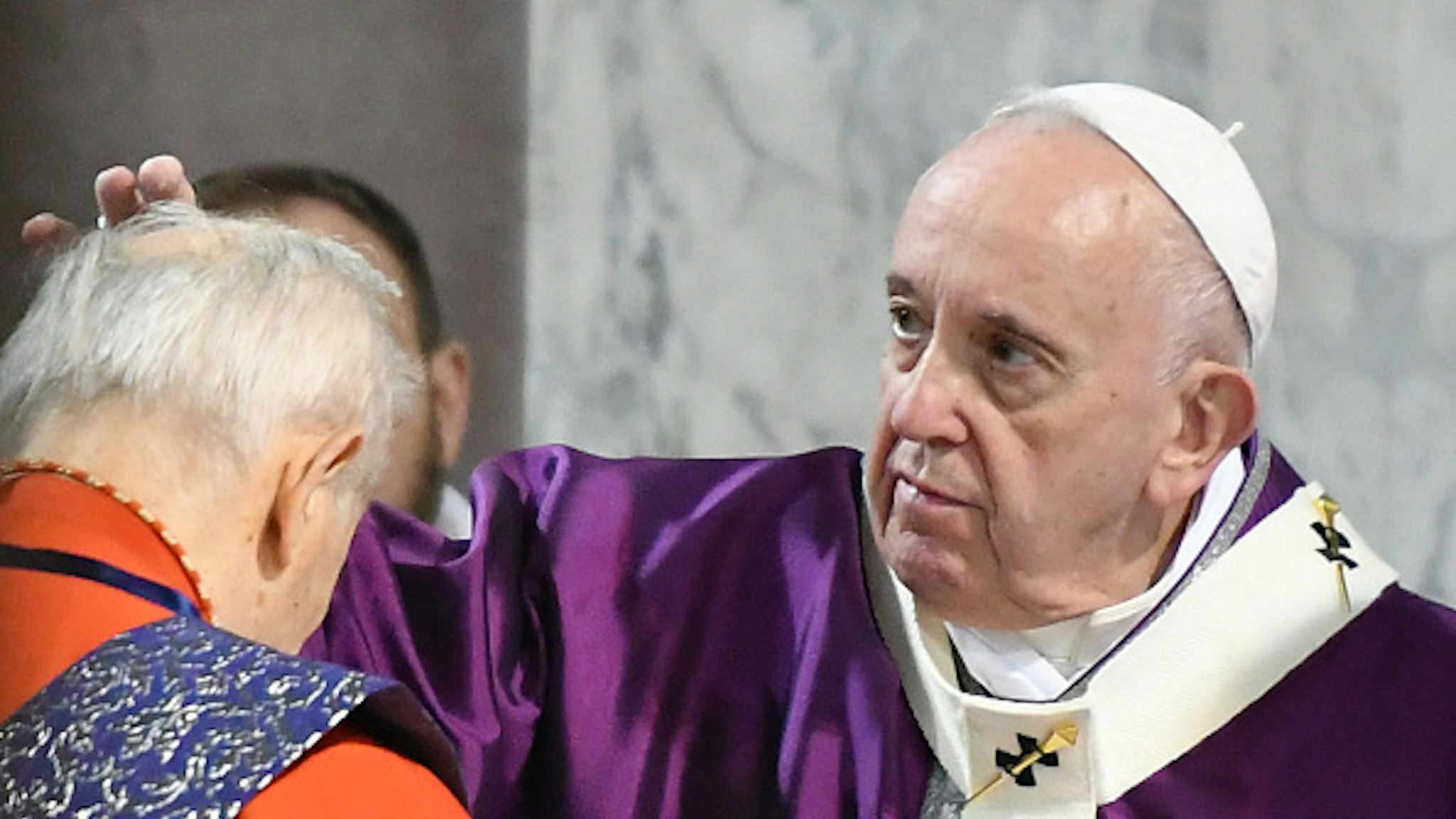 Cardinal Jozef Tomko receives the ashes on the forehead from Pope Francis during the Ash Wednesday mass which opens Lent, the forty-day period of abstinence and deprivation for Christians before Holy Week and Easter, on February 26, 2020, at the Santa Sabina church in Rome.